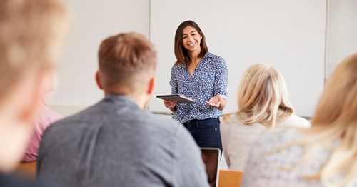 A teacher leads a teacher training session